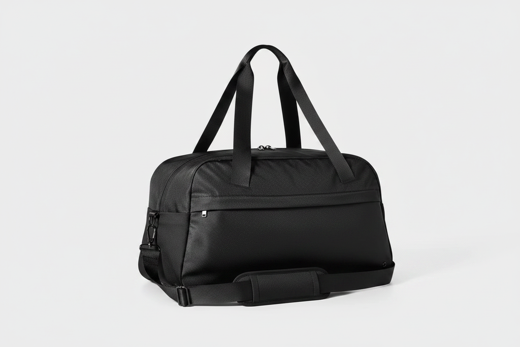 All In Motion black duffle bag with studio lighting on clean background