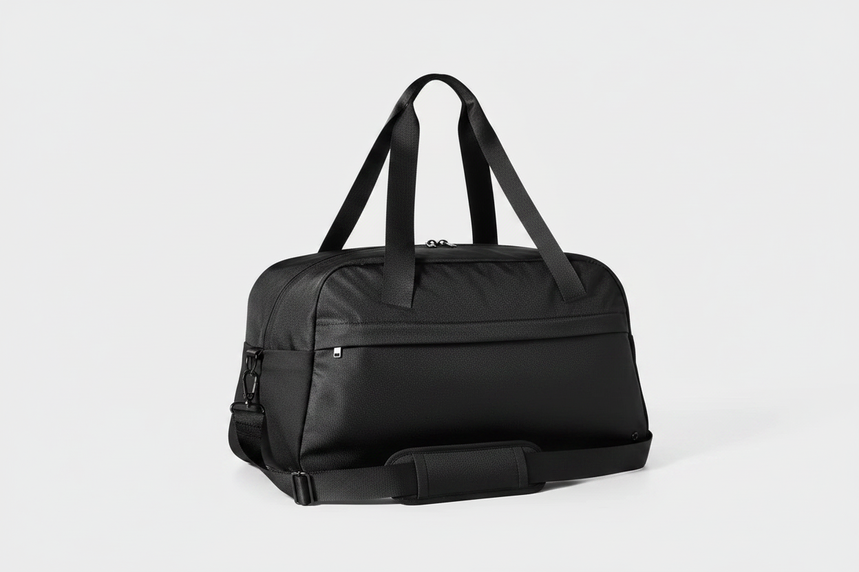 All In Motion black duffle bag with studio lighting on clean background