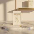 Honey Bear White Eau de Parfum box front on marble surface